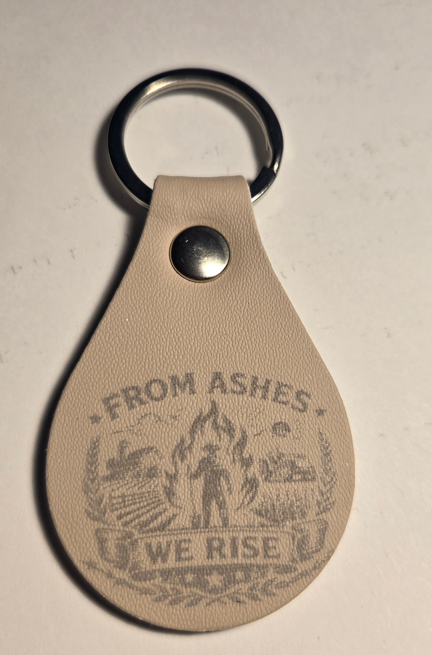 From The Ashes We Rise Keychains