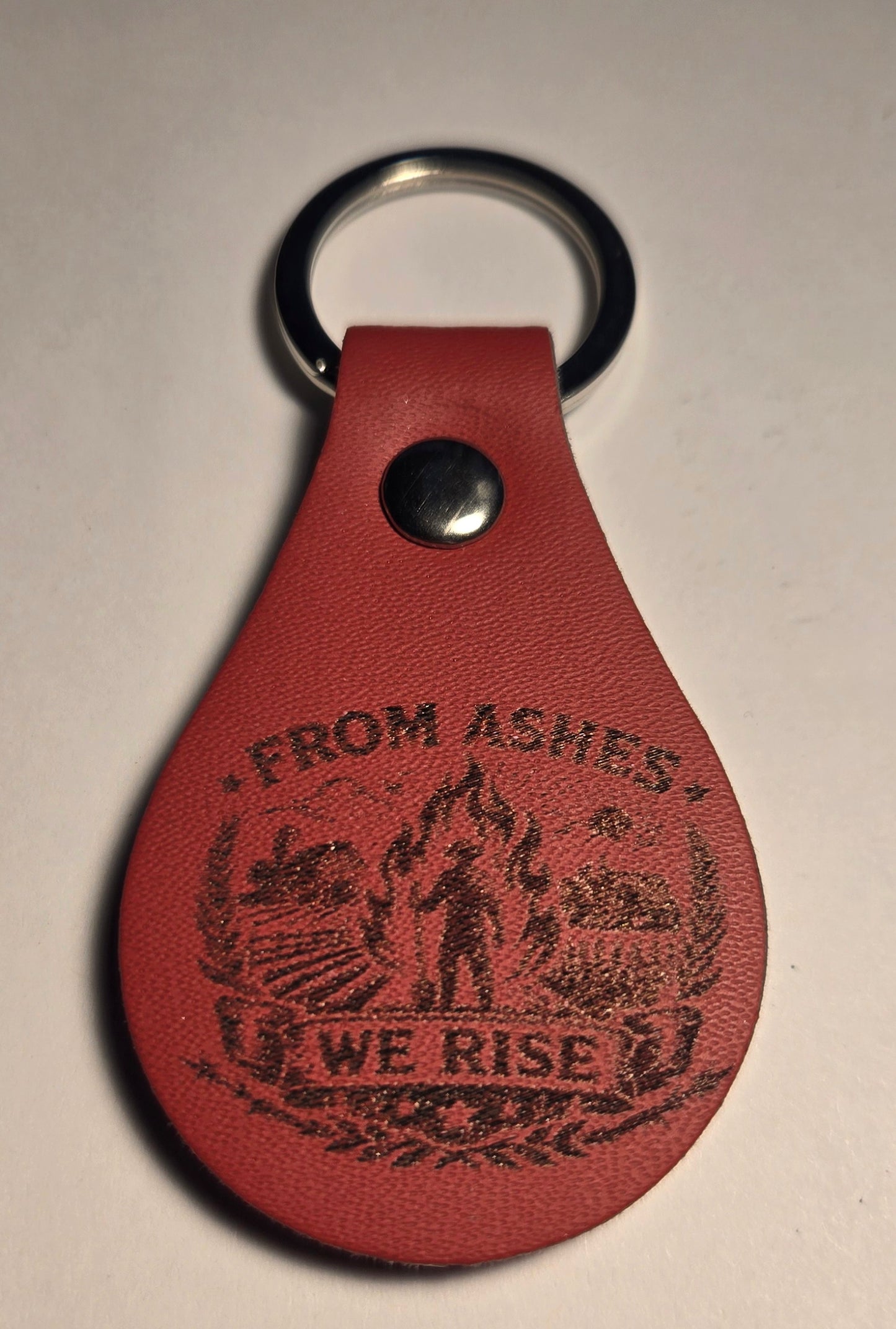 From The Ashes We Rise Keychains