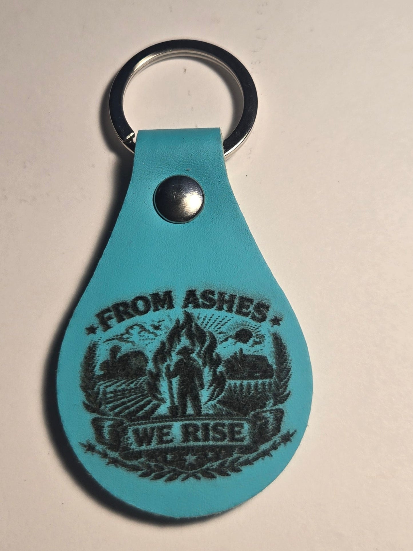 From The Ashes We Rise Keychains